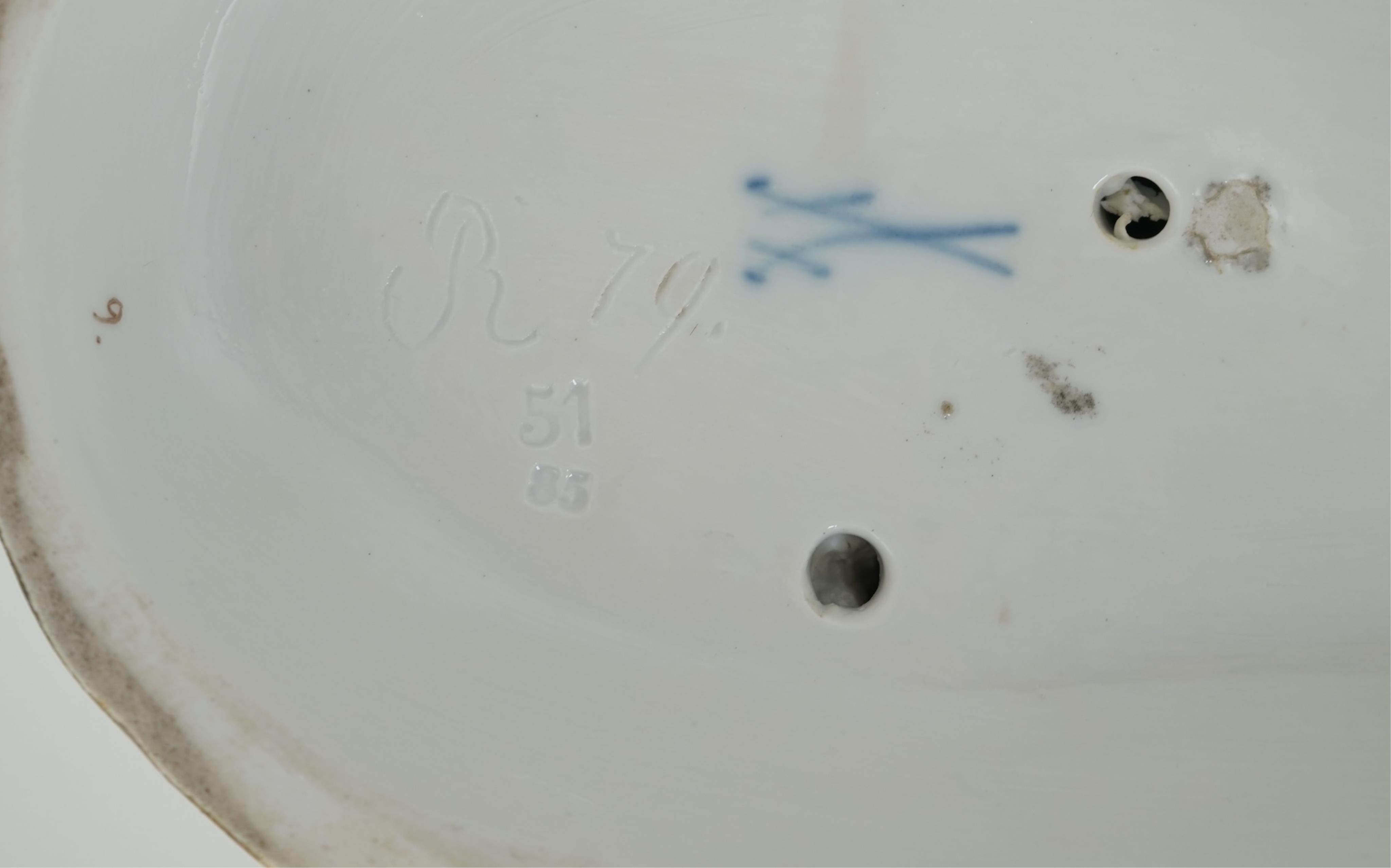 A Meissen group of a boy and girl milking a cow, 19th century